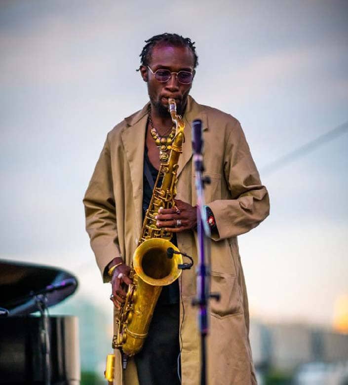 Isaiah Collier playing the saxophone