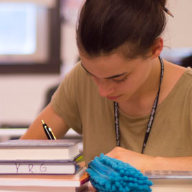 A student concentrating while writing